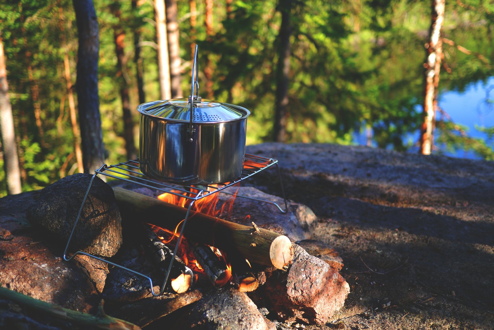 A pot cooking over a campfire