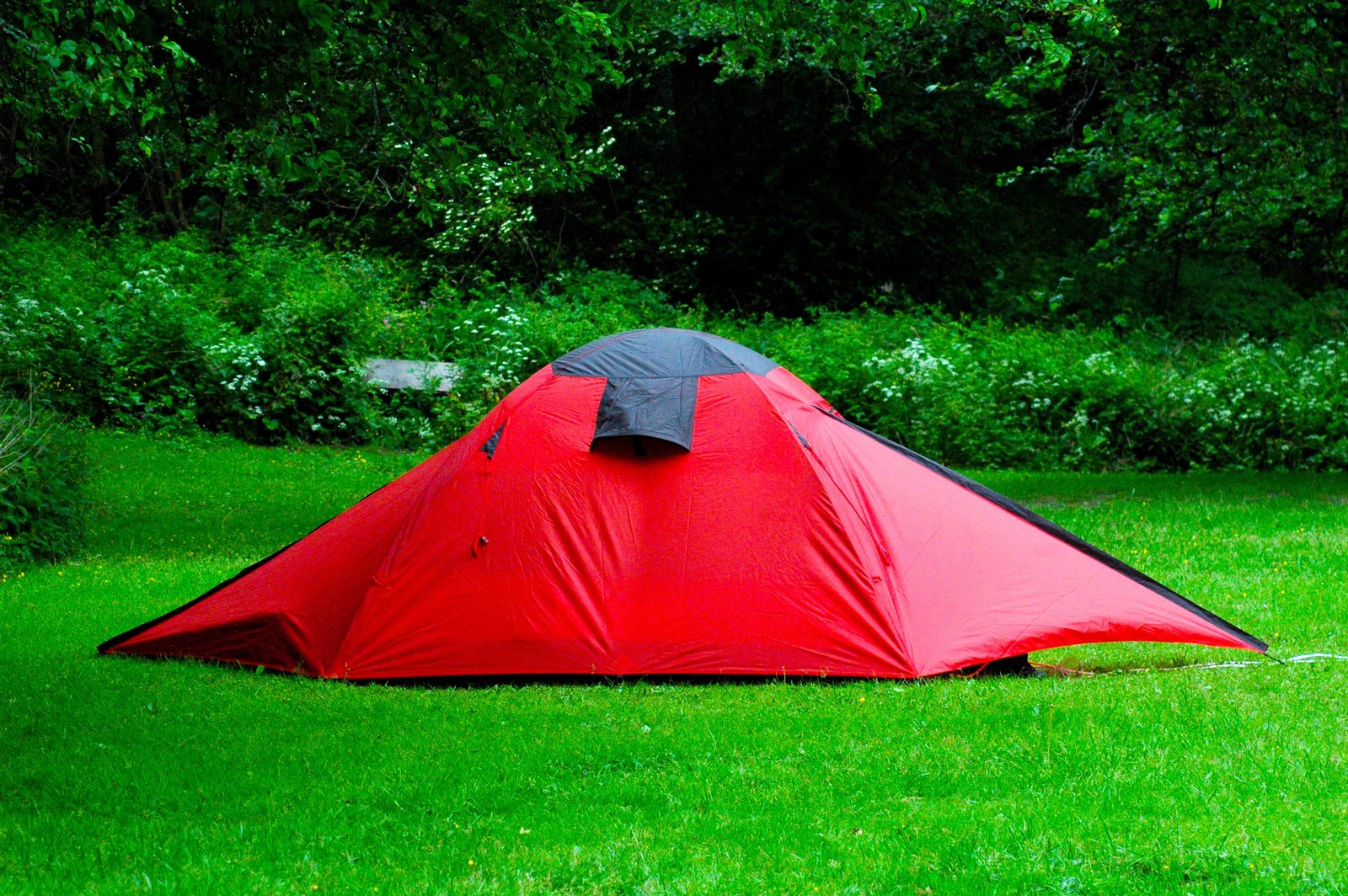 A red tent in a field